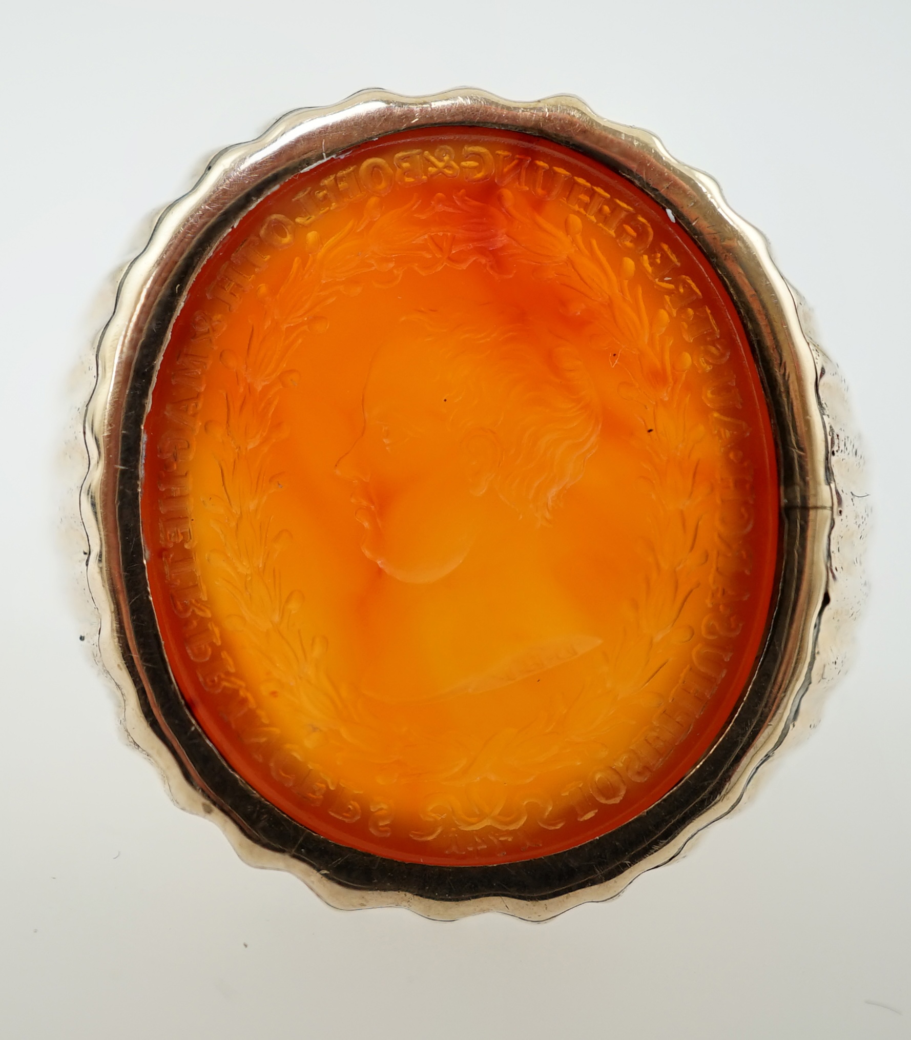 An antique Austro Hungarian gold and carnelian intaglio set oval ring, carved with the bust to dexter of Arch Duke Joseph